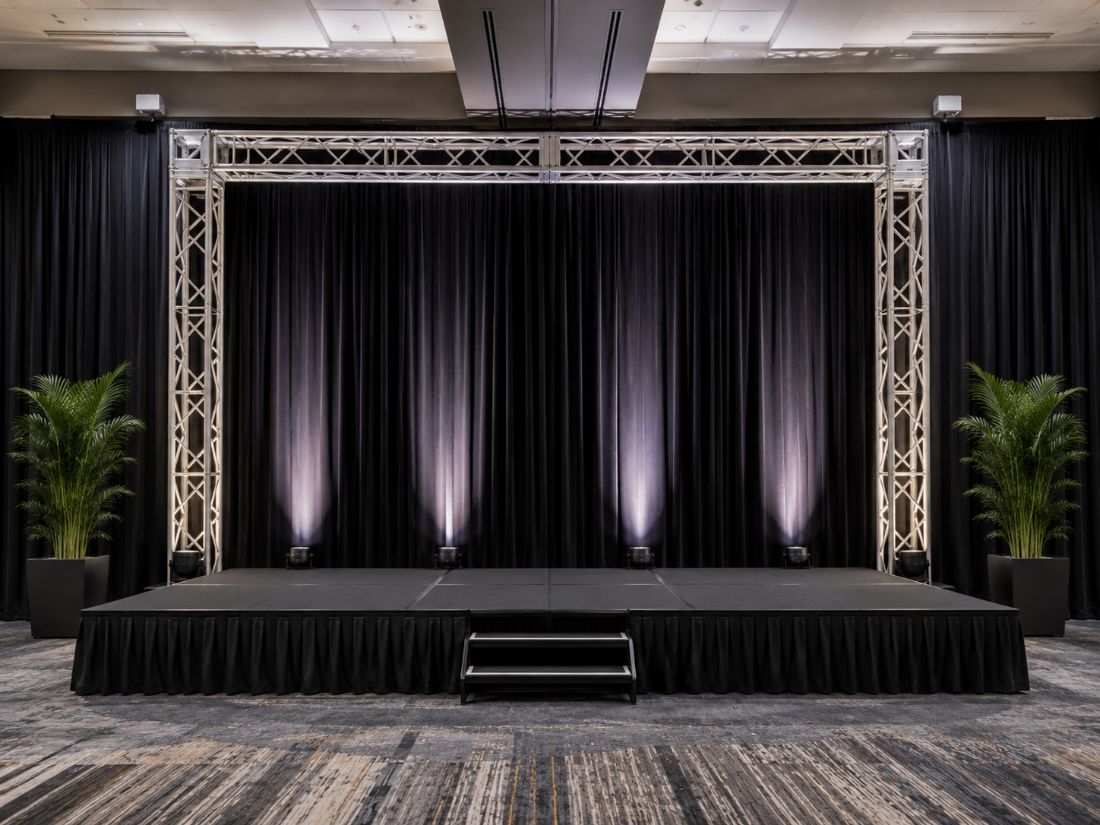 Draped stage with truss surround and risers